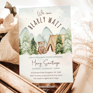 May include: A baby shower invitation with a watercolor illustration of a bear and a tent in a forest setting. The text reads "We can BEARLY WAIT" and includes the name "Mary Santiago" and details for the event.