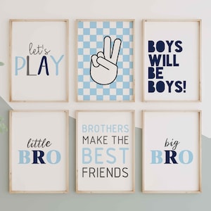 May include: Six framed prints with blue and white checkered backgrounds and navy blue text. The prints feature the phrases "let's play", "boys will be boys", "little bro", "big bro", "brothers make the best friends", and a peace sign.