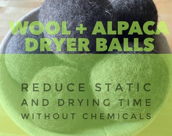 May include: Three gray wool and alpaca dryer balls in a green fabric basket. The text "WOOL + ALPACA DRYER BALLS" is written in black on a green background. The text "REDUCE STATIC AND DRYING TIME WITHOUT CHEMICALS" is written in black on a green background.