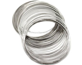 May include: A pile of silver-colored metal wire rings. The rings are stacked on top of each other and are all the same size.