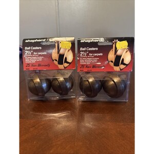 May include: Two packages of Shepherd ball casters, 2 1/2 inches for carpets. Each package contains two casters with a bronze finish. The packaging includes text indicating they are for heavy-weight furniture and have a 25-year warranty.