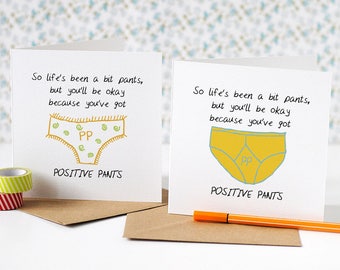May include: Two greeting cards with a humorous message about having "positive pants". The cards feature a cartoon illustration of yellow underwear with the letters "PP" inside.
