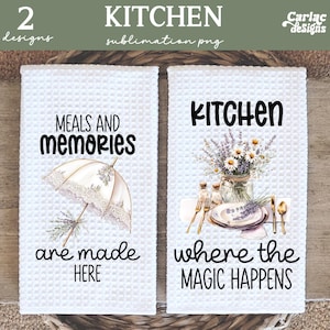 May include: Two white kitchen towels with waffle texture. One towel reads "MEALS AND MEMORIES are made HERE" with an umbrella illustration. The other reads "KITCHEN where the MAGIC HAPPENS" with a floral arrangement.