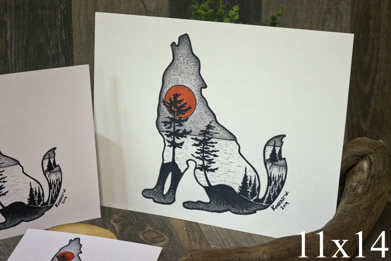 May include: Black and white illustration of a wolf howling at a red sun. The wolf's silhouette is filled with a forest scene, including trees and a lake. The artwork is signed "Kamarad" and dated "2019".
