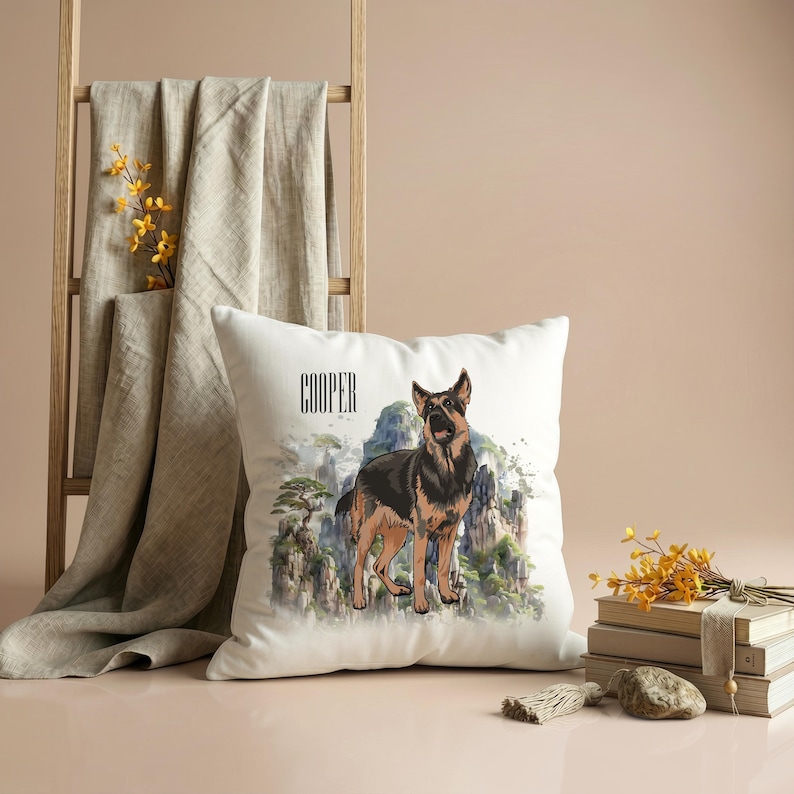 May include: White square throw pillow featuring a watercolor illustration of a German Shepherd dog standing in front of a mountain landscape. The dog is black and tan. The name "COOPER" is printed above the dog. Decorative home accent.