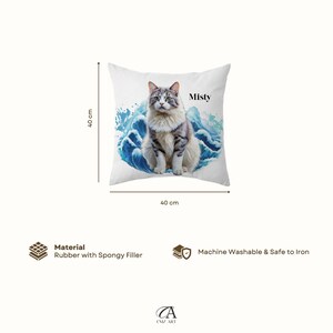 May include: A square pillow, 40 cm x 40 cm, featuring a cat named Misty sitting on a blue wave design. The cat has gray and white fur. The pillow is made of rubber with a spongy filler and is machine washable.