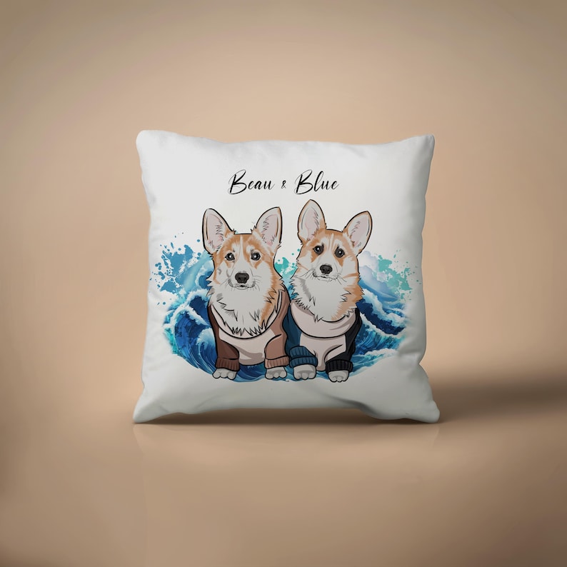 May include: White square pillow featuring two cartoon corgi dogs wearing sweaters, set against a blue wave design. The pillow has the text "Beau & Blue" in a script font.