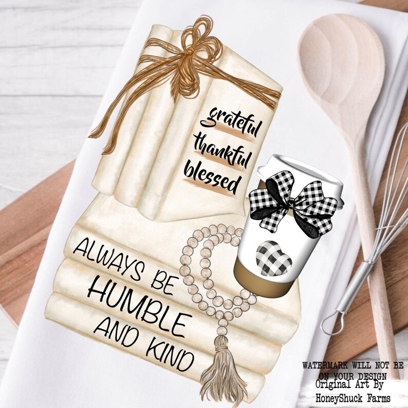 May include: A white kitchen towel featuring a graphic illustration of a stack of cream-colored books tied with twine, a coffee cup with a black and white buffalo check bow and heart, and a string of wooden beads with a tassel and printed text.