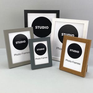 Wooden Photo Frames - Studio Range. Wooden Frames with a woodgrain finish. Made in the UK. Optional machine-cut bevelled mount.