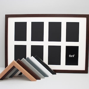 May include: A multi-aperture picture frame with a dark brown wooden frame and a white mount. The frame has eight openings, one labeled "6x4" (15.24 x 10.16 cm). Several angled frame samples in various colours are in front.