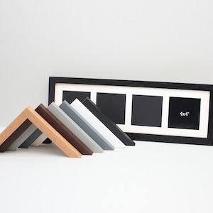 May include: A black picture frame with three openings, each labeled "4x4". Several angled frame samples in various colours, including brown, grey, and white, are arranged in front of the frame. The background is a plain white.