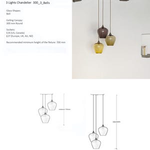 May include: A three-light pendant light with bell-shaped glass shades in amber, brown, and yellow. The fixture has a white ceiling canopy and is suspended by cords. The recommended minimum height is 70 cm.