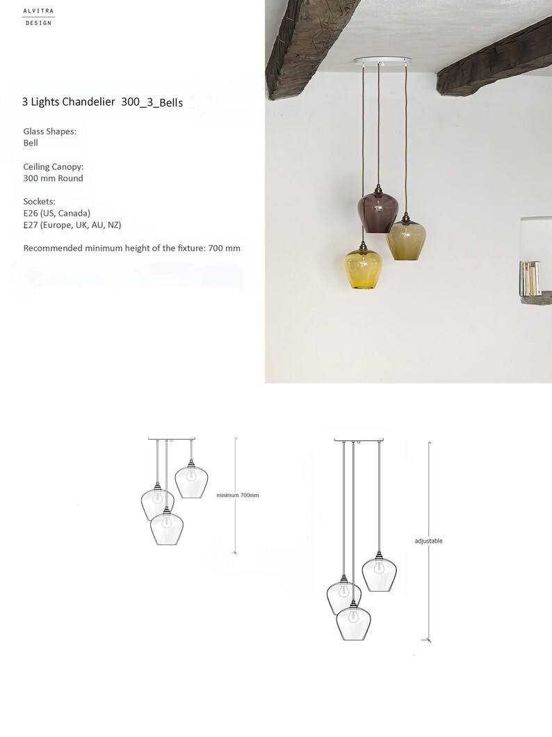 May include: A three-light pendant light with bell-shaped glass shades in amber, brown, and yellow. The fixture has a white ceiling canopy and is suspended by cords. The recommended minimum height is 70 cm.