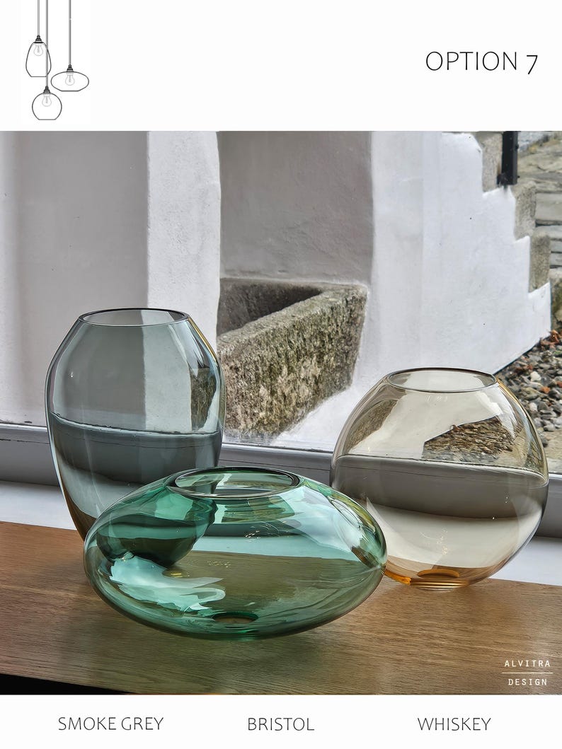 May include: Three glass vases in smoke grey, Bristol green, and whiskey colors. The Bristol vase is a flattened oval shape, while the whiskey vase is spherical. The smoke grey vase is a tall, oval shape. The text "OPTION 7" is visible.