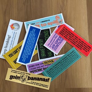 Three random bumper stickers from Slop Corp