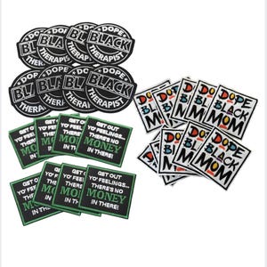 May include: A collection of black and white patches with text. Some patches say "DOPE BLACK THERAPIST" in a circular design. Other patches are rectangular and say "GET OUT YO' FEELINGS... THERE'S NO MONEY IN THERE!" and "DOPE BLACK MOM".