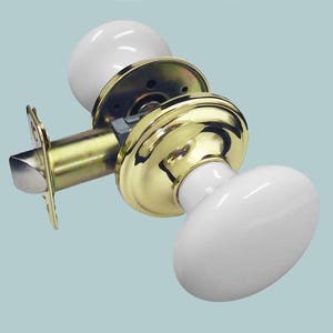 White Porcelain Passage Set Polished Brass Backplate