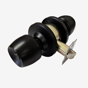 May include: A black door knob with a rounded handle and circular backplates. The door knob has a matte finish and a metal latching mechanism. The hardware is designed for interior doors.