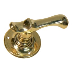 May include: A polished brass door handle with a curved lever and a round base. The handle has a traditional design.