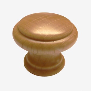May include: A wooden knob with a rounded top and a slightly flared base. The knob is a light brown colour and has a smooth, polished finish.