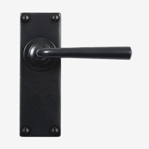 May include: Black door handle with a square backplate and a rounded lever. The handle has a simple design and is made of metal.