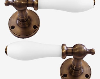 White Porcelain Lever Door Handle On Rose Antique Brass
