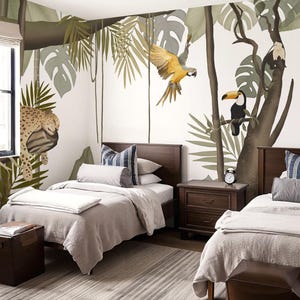 May include: A wall mural featuring a jungle scene with a leopard, a flying yellow macaw, a toucan, and a monkey perched in trees with large green leaves. The mural is behind two twin beds with dark wood frames, light gray bedding, and a striped rug.