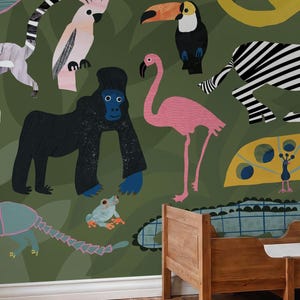 May include: A whimsical jungle-themed wallpaper featuring colorful illustrations of a toucan, flamingo, zebra, gorilla, and other animals. The background is a dark green with leaf patterns, creating a playful and vibrant design.