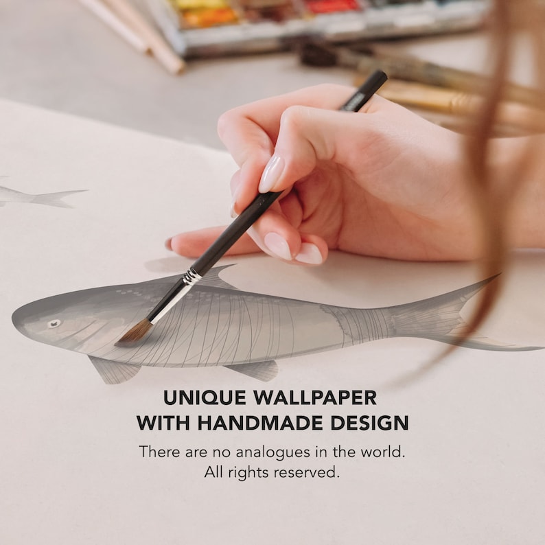 May include: A hand painting a detailed illustration of a fish on a white canvas with a black paintbrush. The text "UNIQUE WALLPAPER WITH HANDMADE DESIGN" is below the image. The text "There are no analogues in the world. All rights reserved." is below the text.
