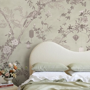 May include: Wallpaper featuring a sage green background with a monochromatic illustration of flowering branches, hanging lanterns, and a bird. The design includes detailed botanical elements and hanging light fixtures in a muted, neutral tone.