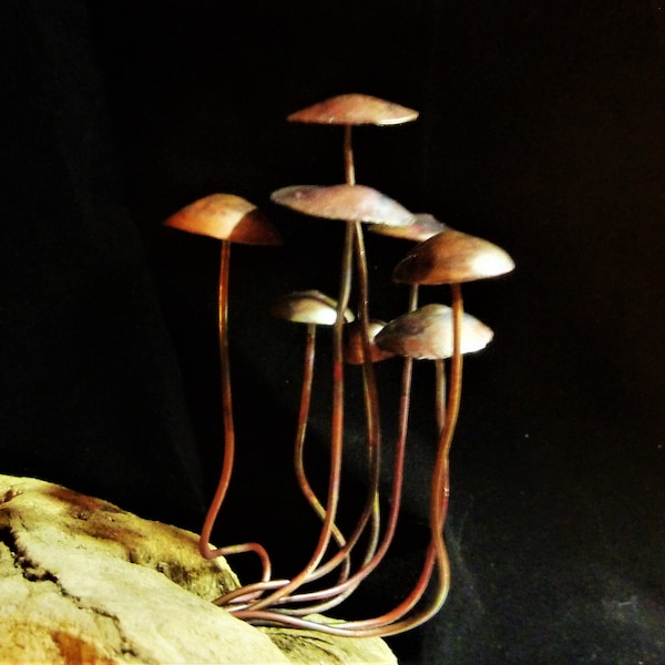 Fairy mushrooms family as colourful copper decor.