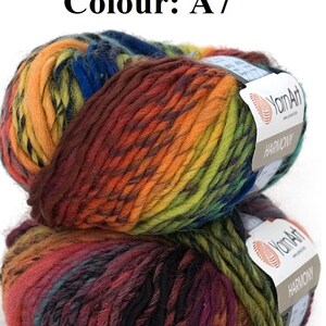 May include: Two balls of YarnArt Harmony yarn in colour A7. The yarn is a blend of colours including orange, yellow, green, blue, and burgundy. Each ball has a label with the YarnArt logo and the word "Harmony".