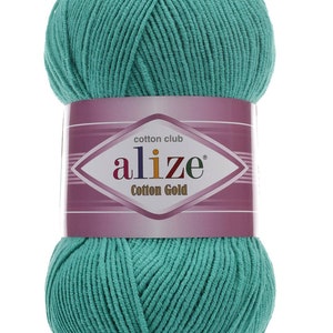 May include: A ball of teal-colored Alize Cotton Gold yarn. The label features the brand name and product details. The number "610" is printed at the bottom. Ideal for knitting and crochet projects.