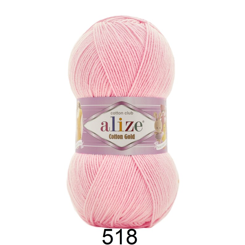 May include: A ball of light pink Alize Cotton Gold yarn. The yarn is wrapped with a label that reads "Cotton Club" and "Alize Cotton Gold". The number "518" is printed at the bottom of the ball of yarn.