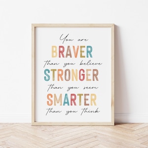 May include: A motivational quote in a colorful, rainbow-themed design. The quote reads "You are BRAVER than you believe STRONGER than you seem SMARTER than you think."