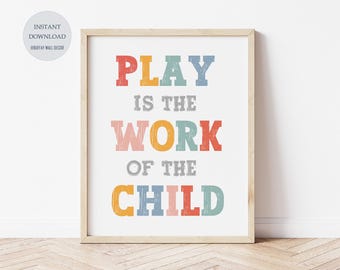 May include: A colorful printable wall art print with the text "PLAY IS THE WORK OF THE CHILD" in a rainbow color scheme. The text is in a vintage, distressed font style.