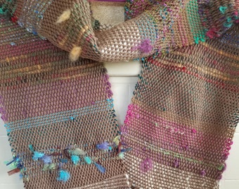 Beautiful medium weight hand-woven scarf. Browns, blues, greens, beige.