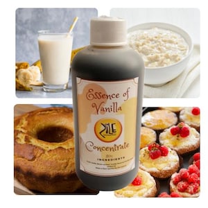 May include: A brown glass bottle of vanilla extract concentrate labeled "Essence of Vanilla" with the brand name "Zile" in a white circle. The bottle is sitting on a table with a variety of baked goods, including a cake, a bowl of oatmeal, and a glass of milk.