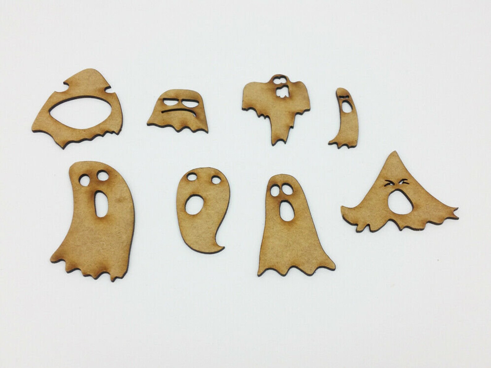 6. Spine-Chilling Silhouettes: Wooden Ghost Cutouts For A Haunted Atmosphere