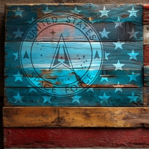 May include: Wooden American flag with the United States Space Force logo. The flag features red, white, and blue stripes, with a blue field containing white stars and the Space Force emblem. The design is distressed, giving it a rustic appearance.