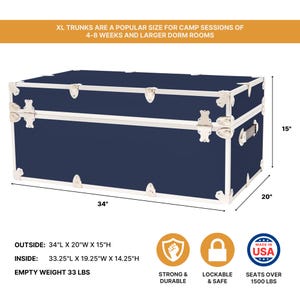 May include: A navy blue trunk with silver-colored trim and hardware. The trunk measures 34 inches long, 20 inches wide, and 15 inches high. The text on the image says "XL TRUNKS ARE A POPULAR SIZE FOR CAMP SESSIONS OF 4-8 WEEKS AND LARGER DORM ROOMS."