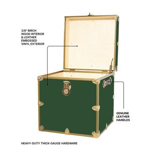 May include: A green trunk with a brass-colored frame and hardware. The trunk has a birch wood interior and a leather embossed vinyl exterior. It features genuine leather handles and heavy-duty thick-gauge hardware.