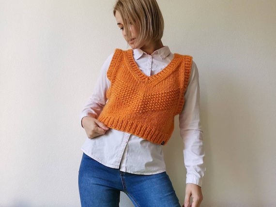 Orange sleeveless best sale sweater