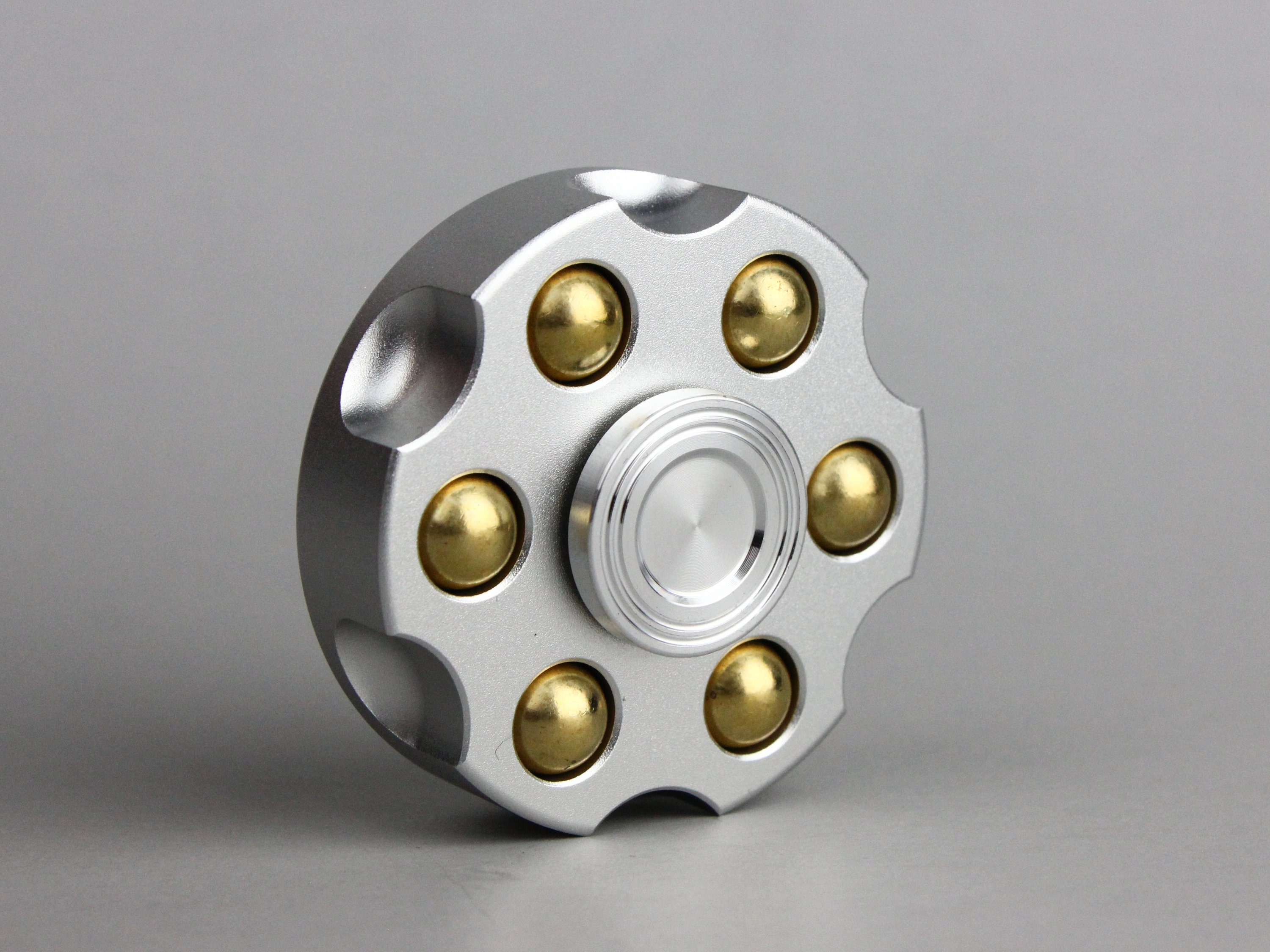 Revolver fidget spinner métal en laiton avec finition colorée plaquée.  Poids amovibles -  France