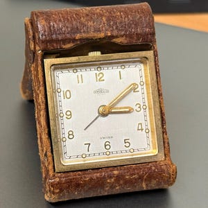 Reloj despertador de escritorio/viaje Angelus vintage, plegable, 15 joyas, en funcionamiento.