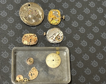 Omega Eterna Tissot movimenti orologi rari pezzi di ricambio riparazione lotto di lavoro