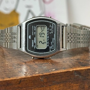 Orologio digitale anni '70, cronografo al quarzo Orient, modello giapponese I720104-40 CS