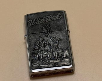 Vintage Zippo wild west petrol lighter Z XII, chrome finish, rare collectible, classic pocket lighter, ornate design, brushed metal