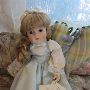 Music Box Doll,Vintage 80&#39;s ,Glass Eyes and Porcelain, Wind Up and it Plays  Love Song Theme, Tags Intact/ New Old Stock by Gorham Co.