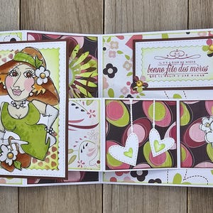 May include: A handmade Mother's Day card with a whimsical illustration of a woman in a hat and dress. The card features floral patterns in pink, green, and brown, with the French text "bonne f&ecirc;te des m&egrave;res".